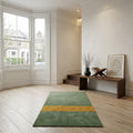 Bespoke luxury prayer rug featuring a striking two tone design on a wooden floor
