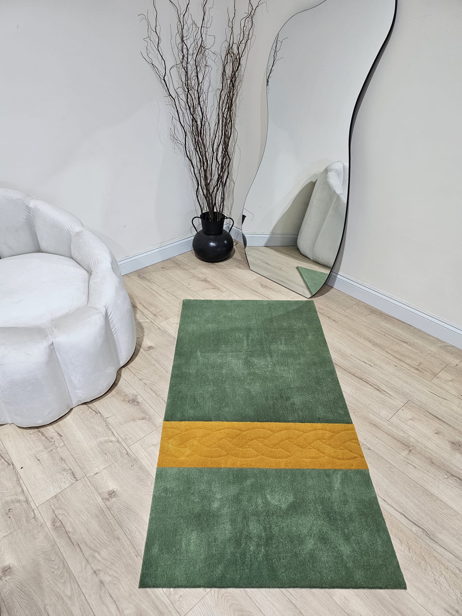 Handcrafted premium mat with a rich hue and central contemporary pattern
